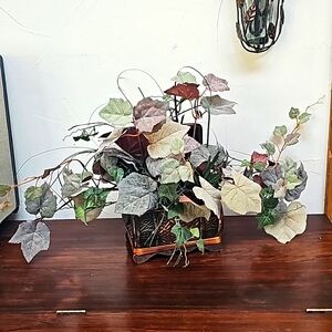 Vintage faux plant in wooden chest box decoration